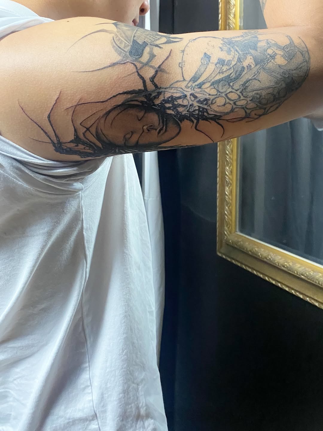 Tattoo by @bloodwork.ink — black_and_grey, dark_realism