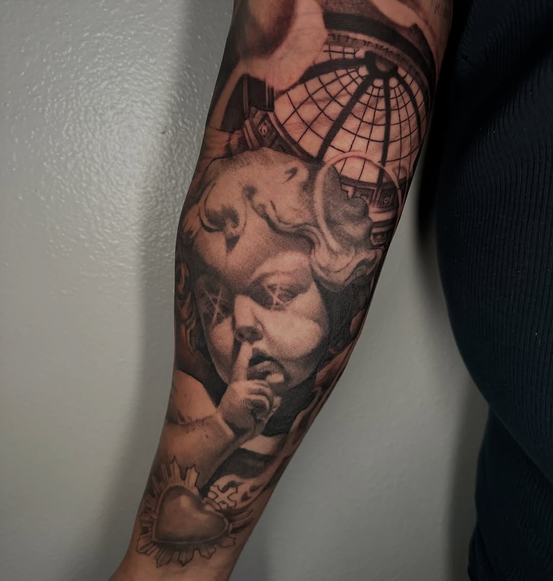 Tattoo by @tattooz_by_trent — realism, black_and_grey