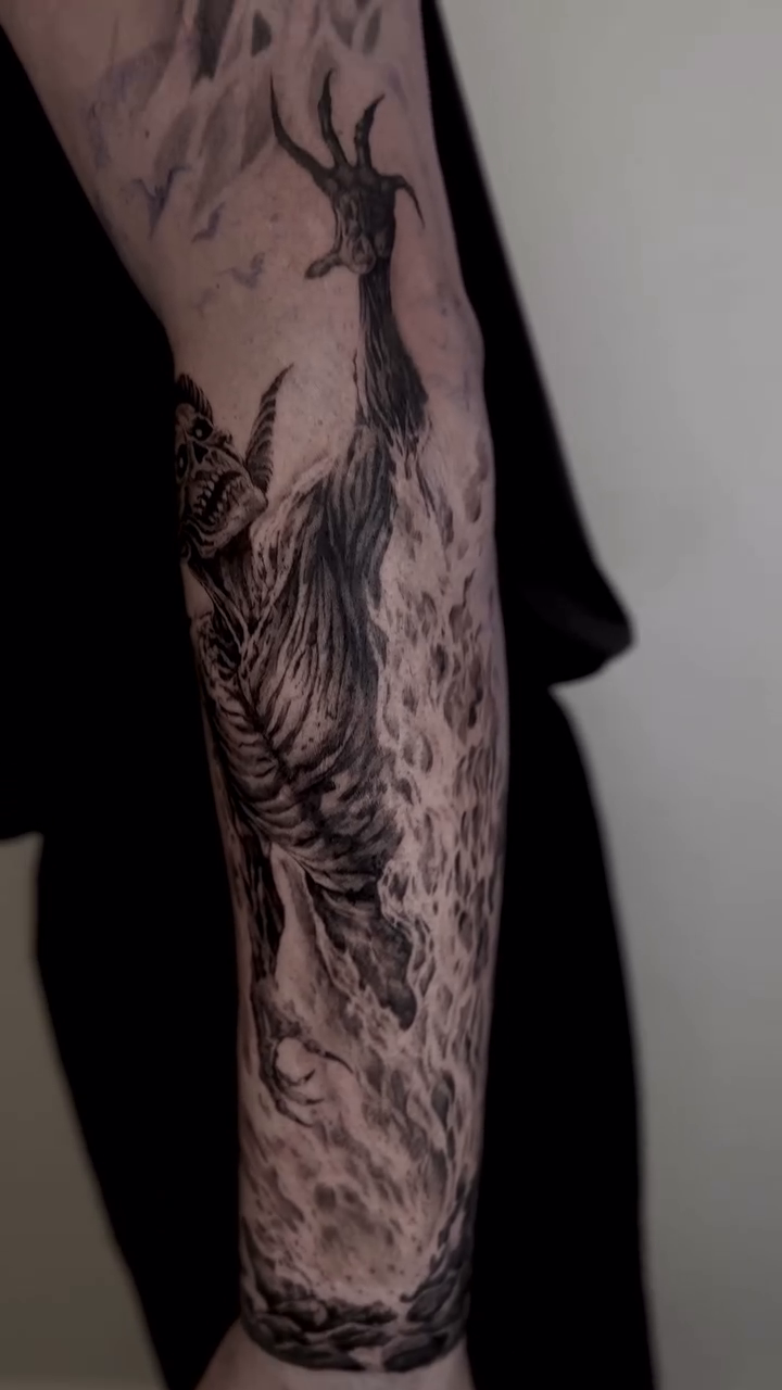 Tattoo by @kris_tattooart — dark_realism, black_and_grey