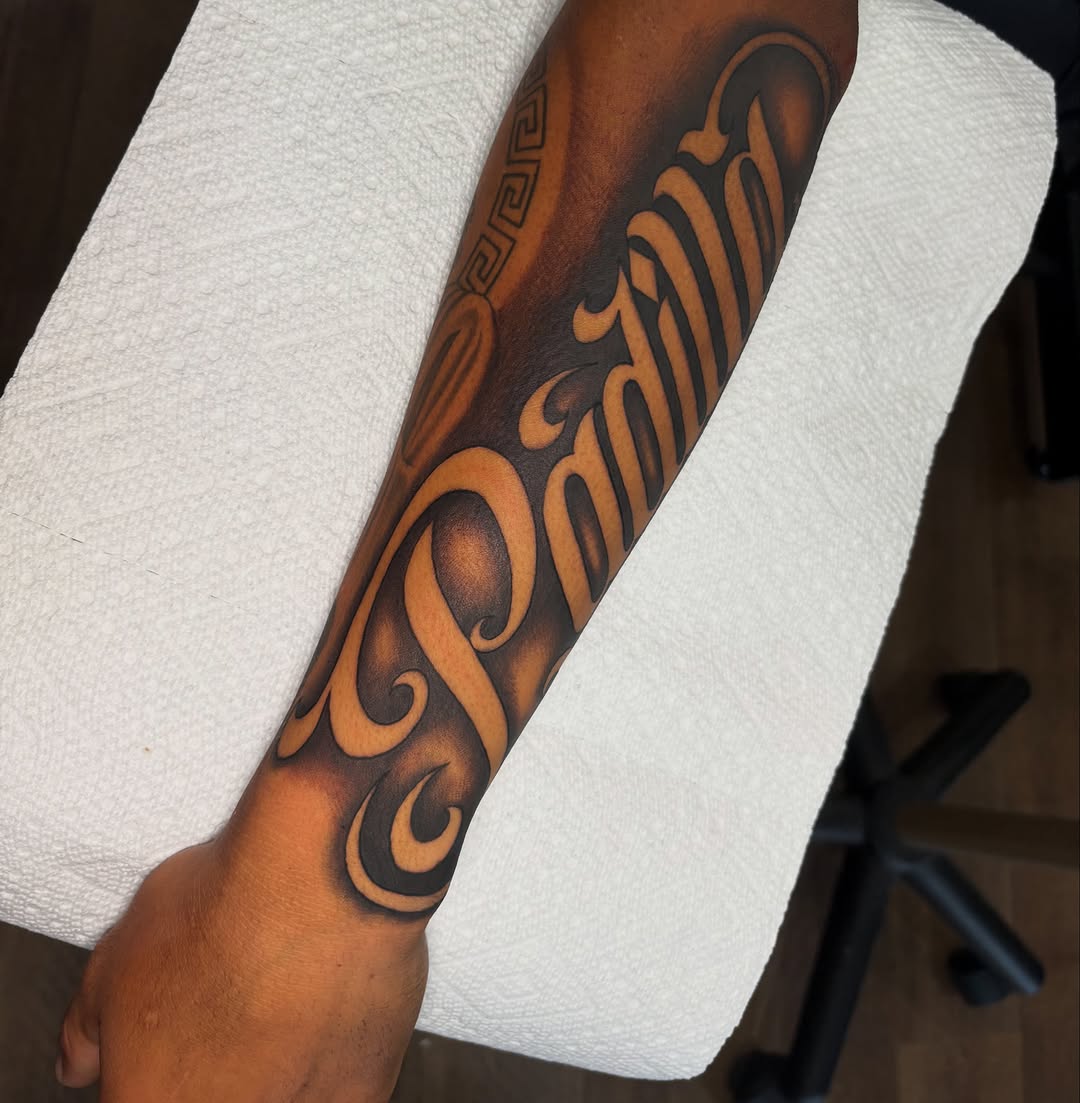 Tattoo by @osieltattoos โ lettering_script, black_and_grey