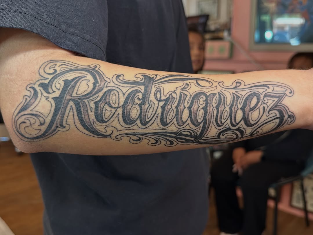 Tattoo by @andrewmontoyatattoo — lettering_script, chicano