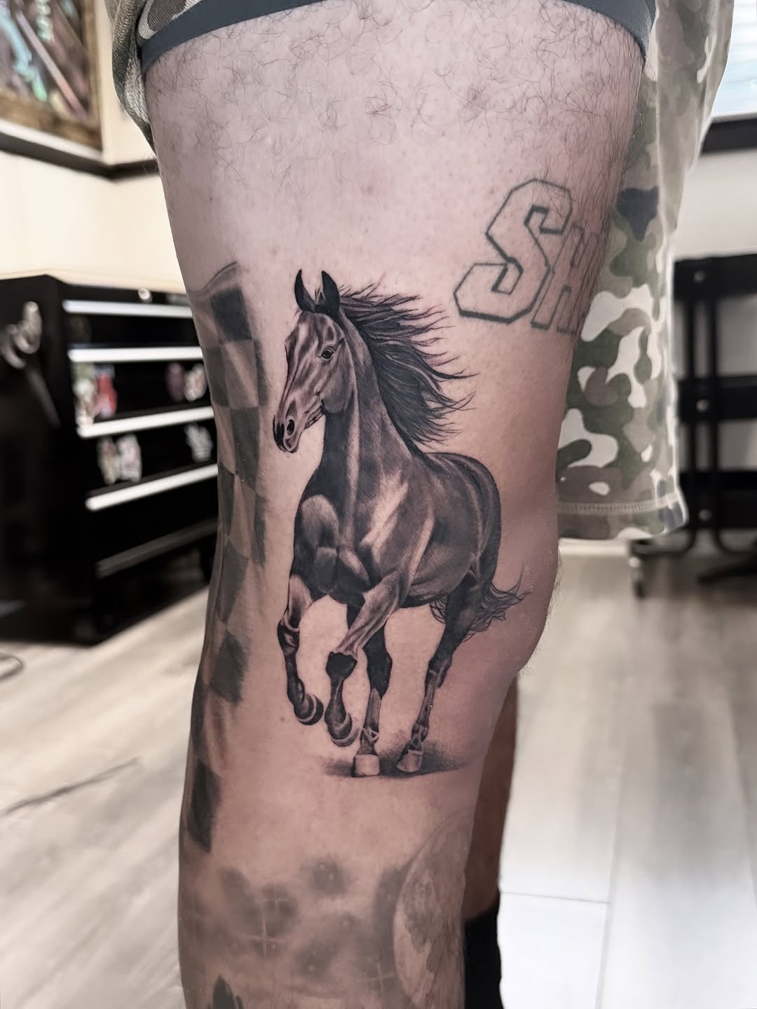 Tattoo by @tee.tattoo — realism, black_and_grey