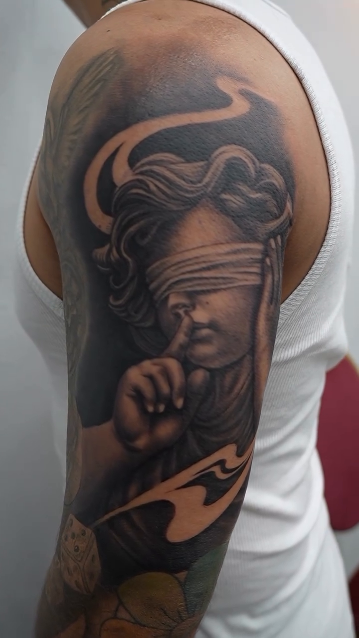 Tattoo by @bornrebel_tattoos โ realism, black_and_grey