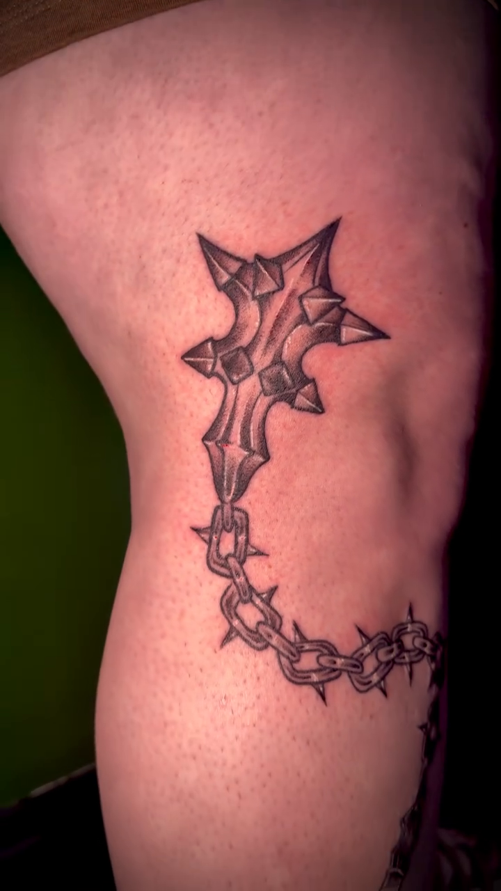 Tattoo by @squirt.tattoos — illustrative, blackwork