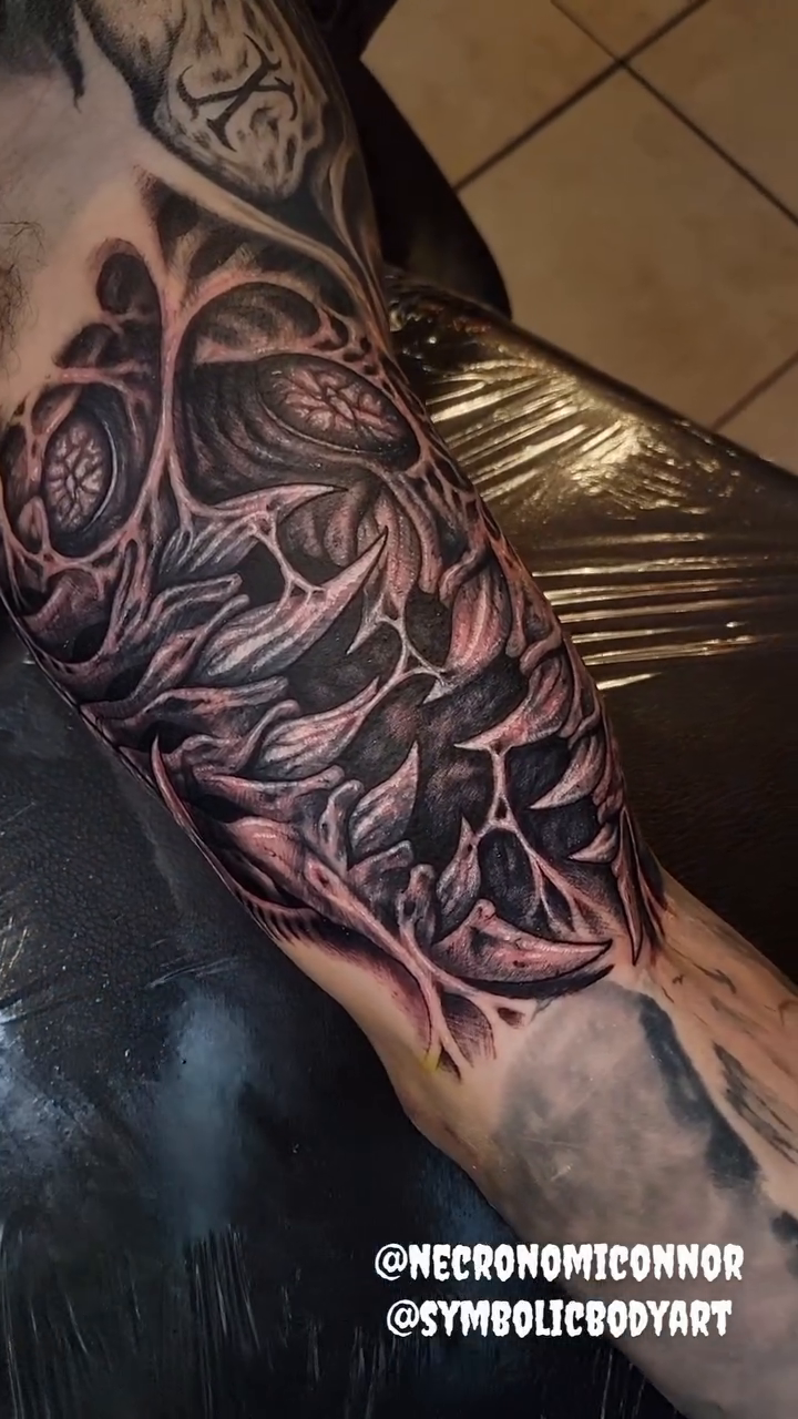 Tattoo by @necronomiconnor — black_and_grey, realism