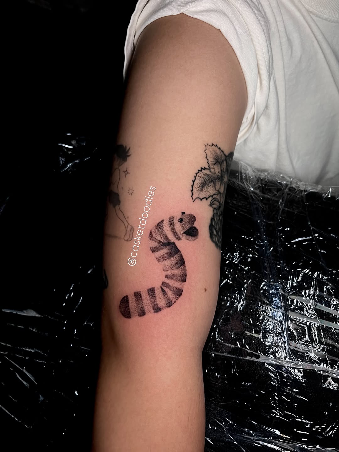 Tattoo by @casketdoodles — illustrative, dotwork