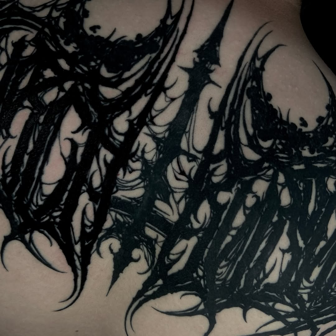 Tattoo by @baptism_black — lettering_script, blackwork
