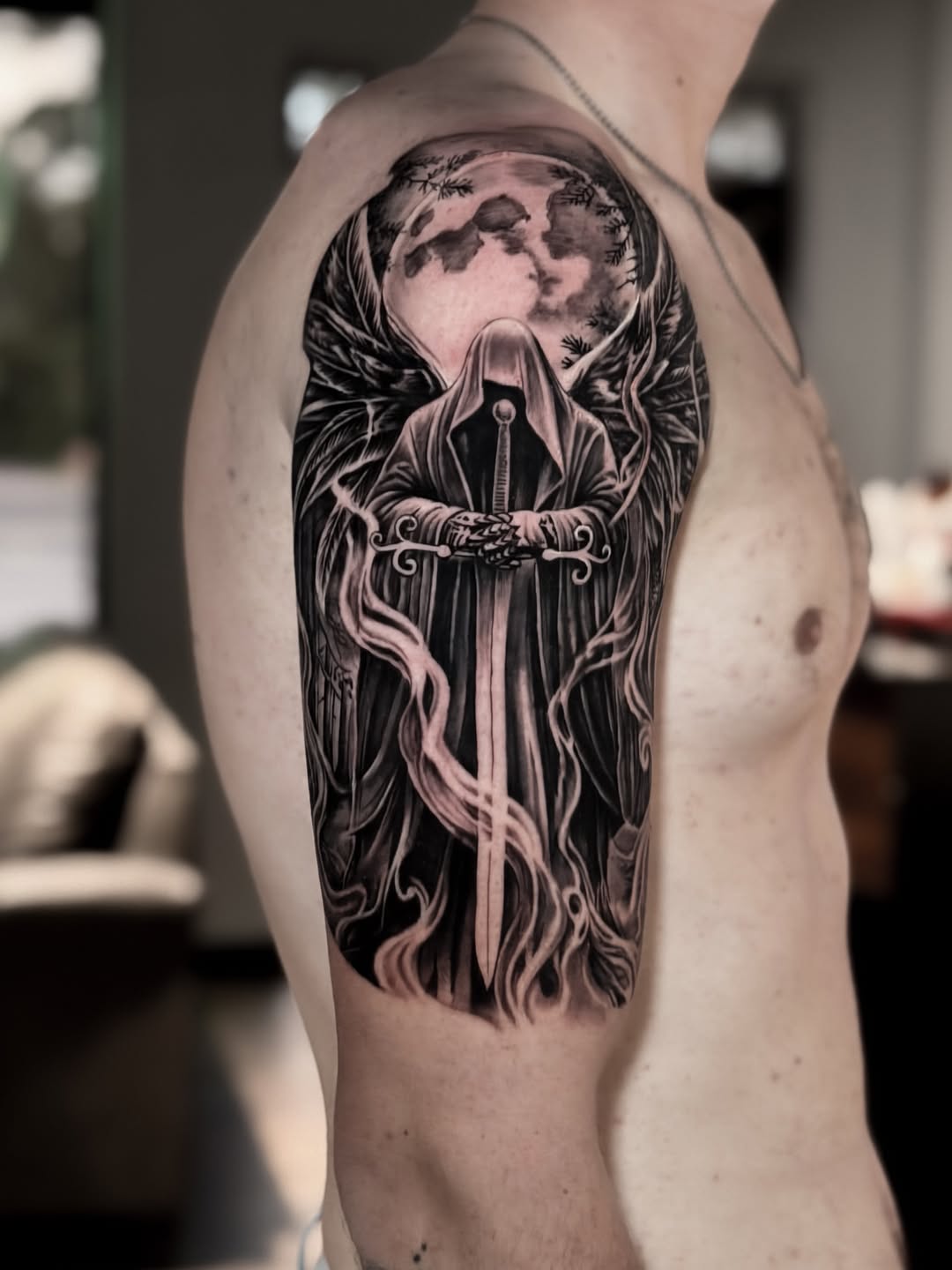 Tattoo by @tuantran.ink — black_and_grey, realism