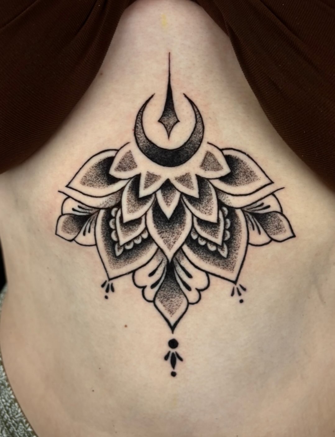 Tattoo by @cryptid.tattoo — dotwork, geometric