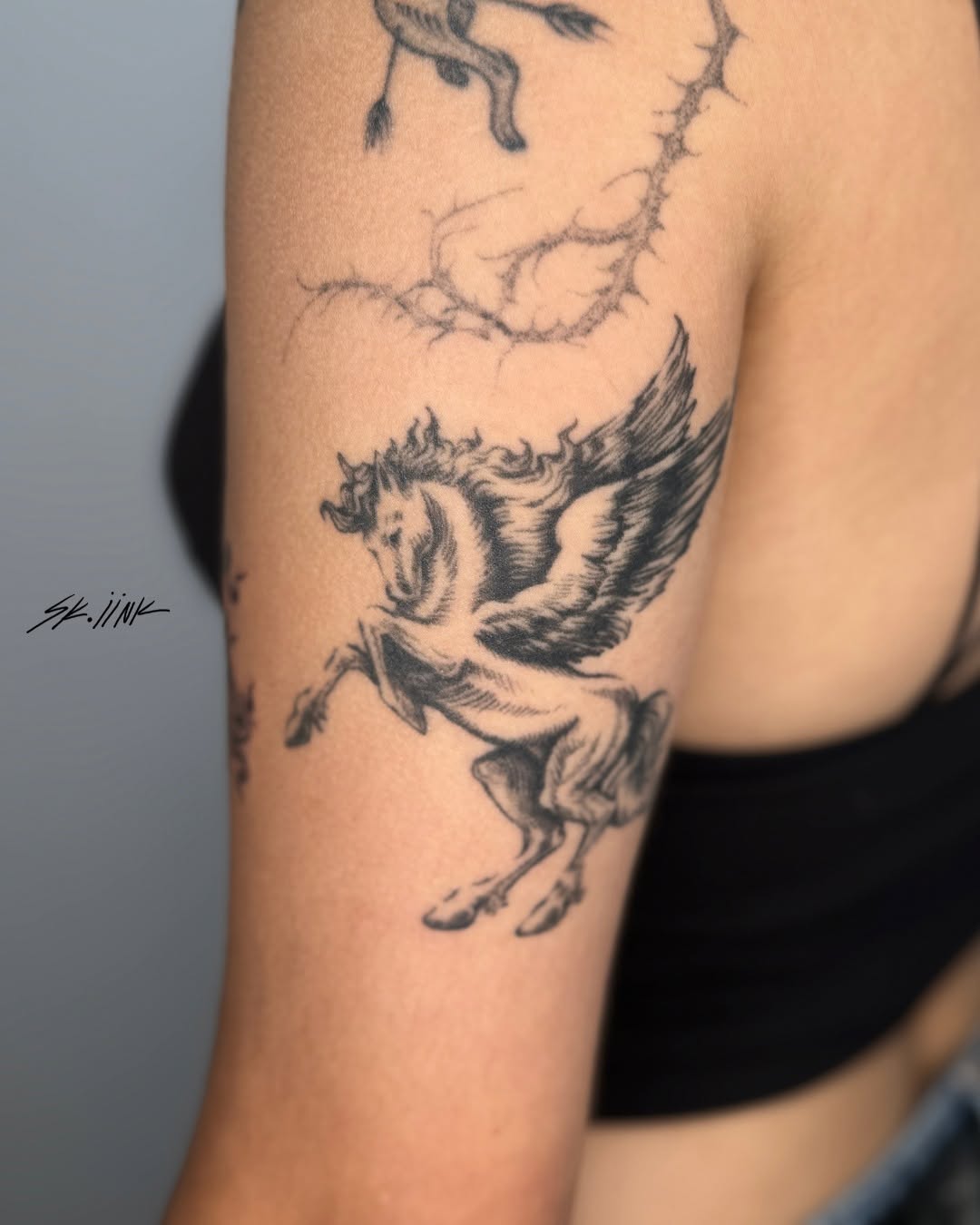 Tattoo by @sk.iink — black_and_grey, illustrative