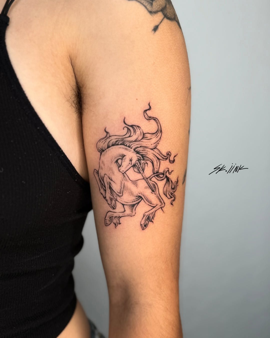 Tattoo by @sk.iink — illustrative, fine_line