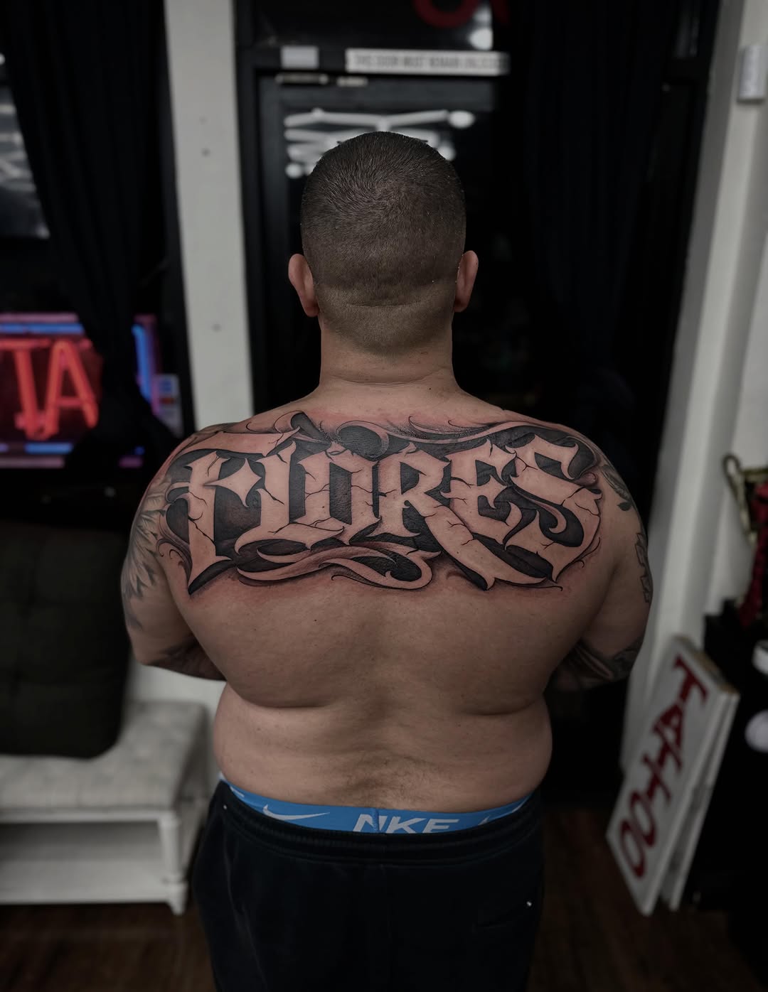 Tattoo by @rubenruiz_tattoos — lettering_script, black_and_grey