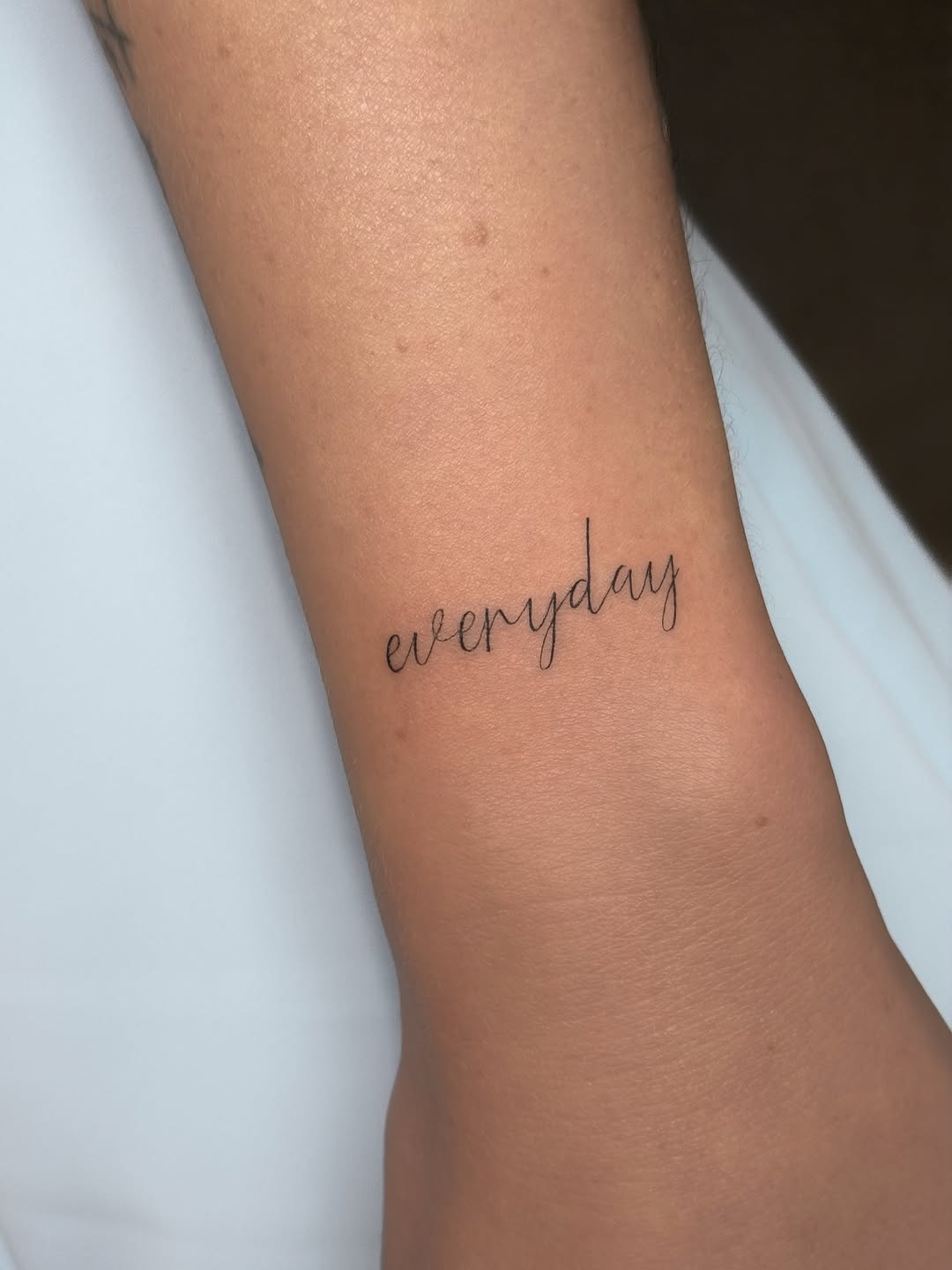 Tattoo by @auras.tattoos — fine_line, lettering_script