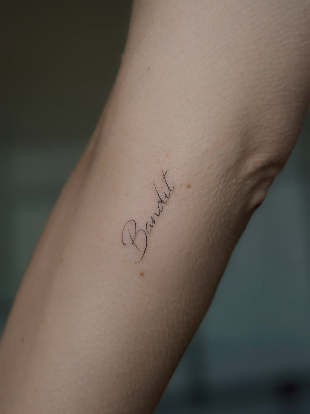 Tattoo by @auras.tattoos — fine_line, lettering_script