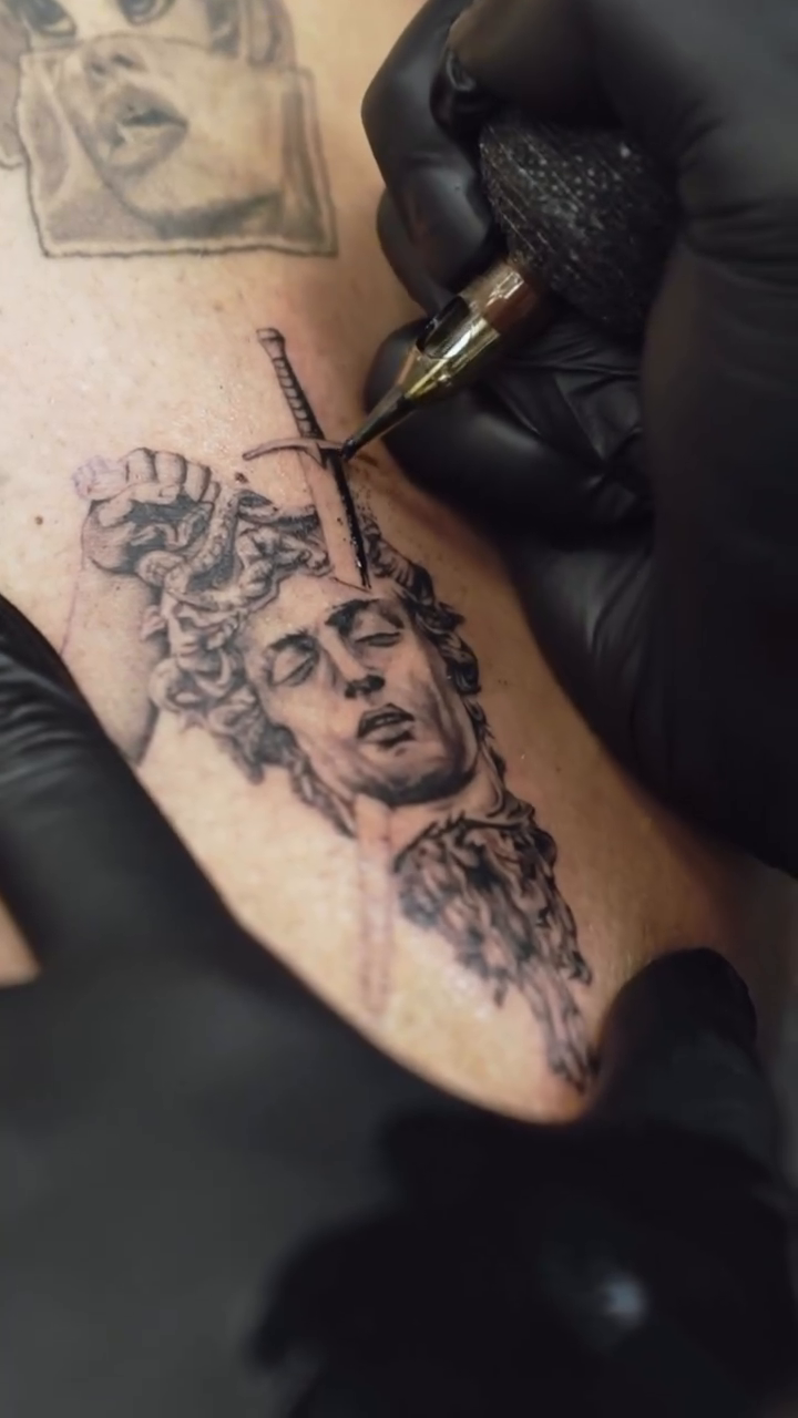 Tattoo by @kidneedle_tattoo β realism, black_and_grey