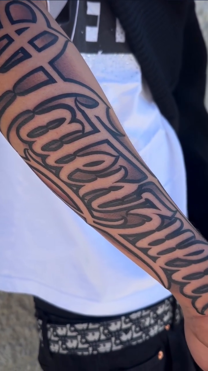 Tattoo by @mottatattoos โ lettering_script, black_and_grey