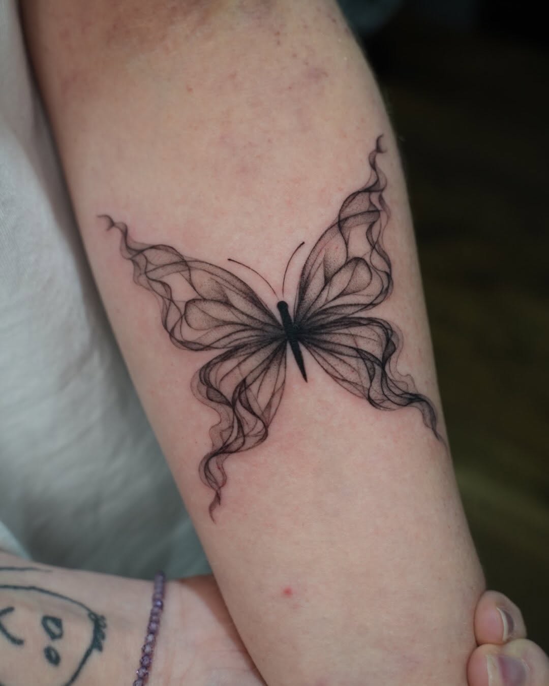 Tattoo by @tattooer_r.tee — fine_line, black_and_grey