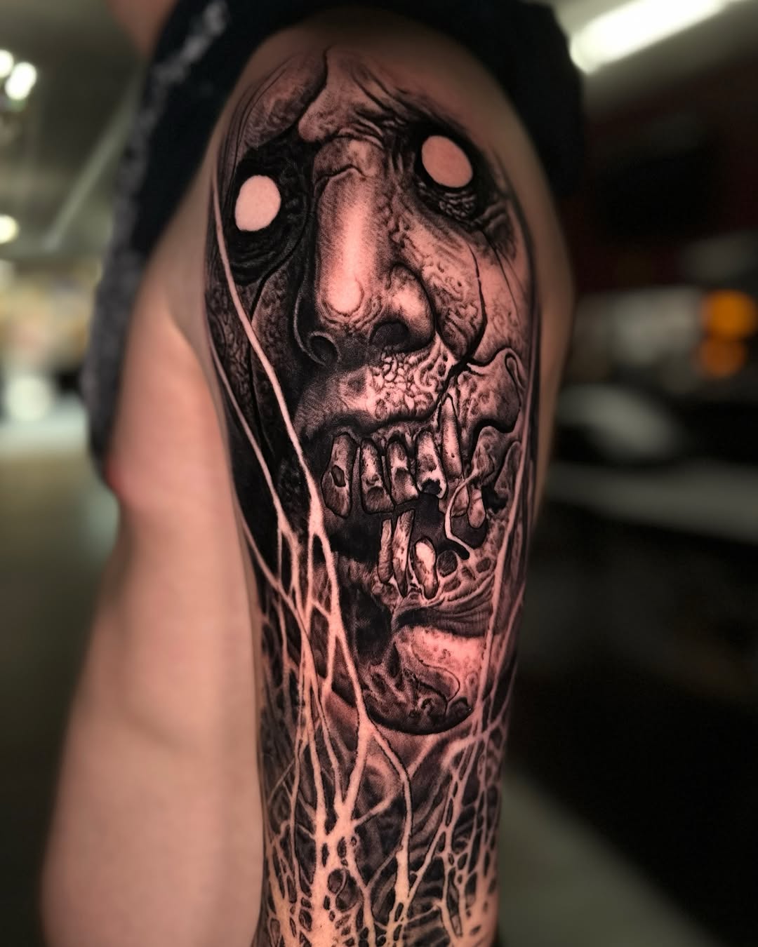 Tattoo by @jessewhitetattoo — dark_realism, black_and_grey