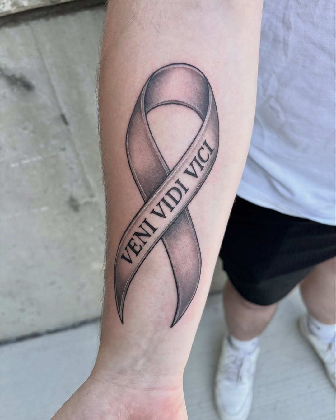 Tattoo by @vang.studio — black_and_grey, lettering_script