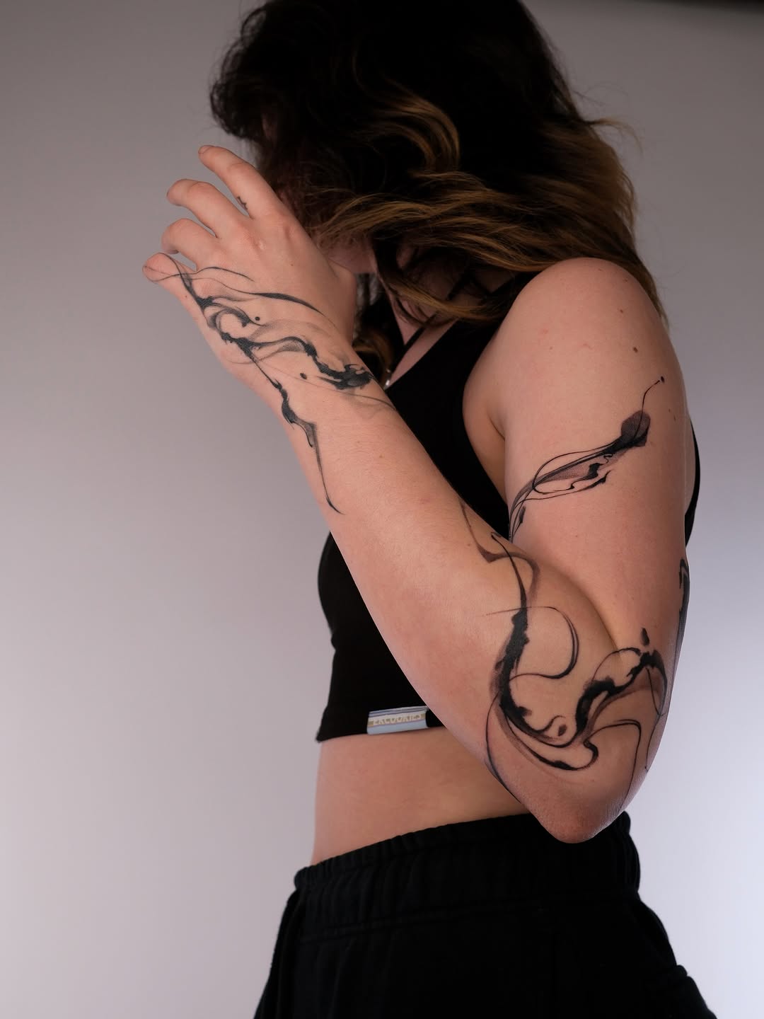 Tattoo by @karmon.tat — illustrative, blackwork