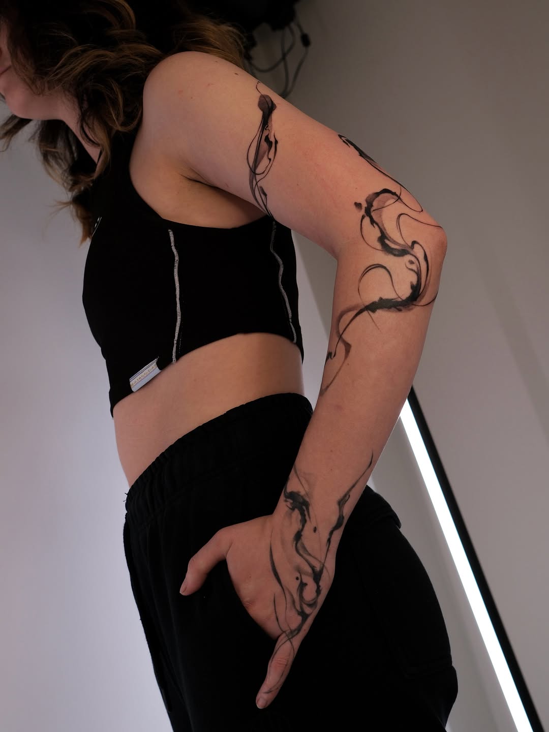 Tattoo by @karmon.tat — illustrative, blackwork