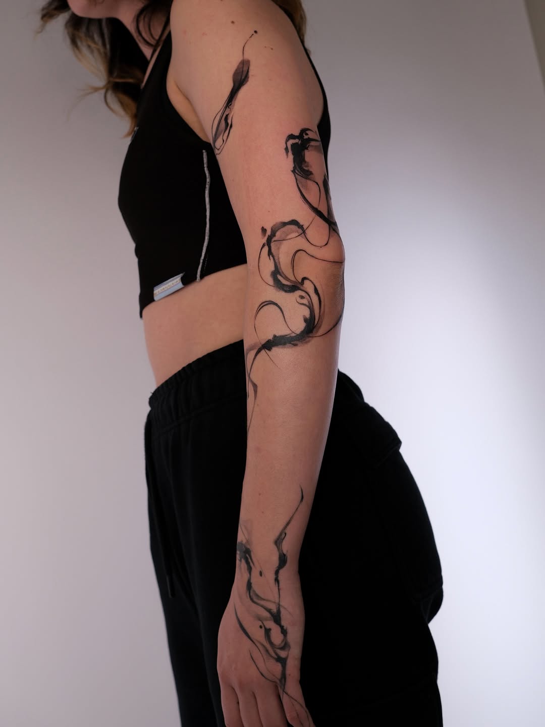 Tattoo by @karmon.tat — illustrative, blackwork