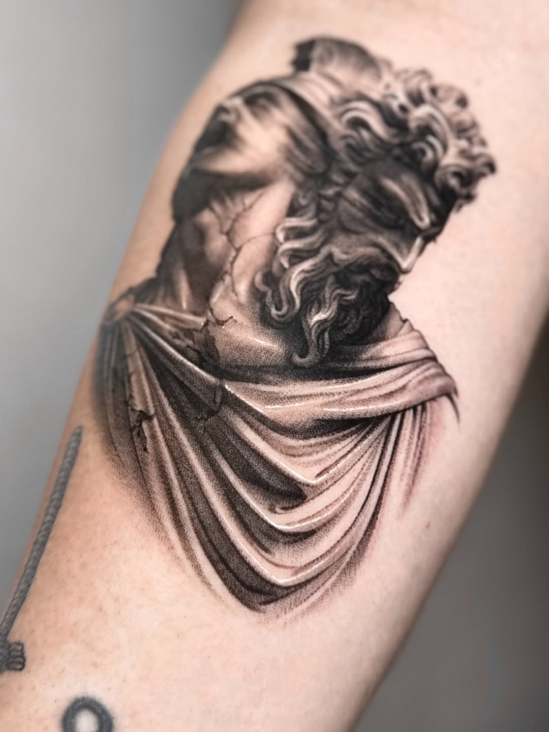 Tattoo by @_via_saru — black_and_grey, realism