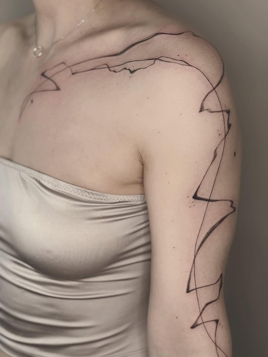 Tattoo by @masha.khelik.ttt — fine_line, black_and_grey