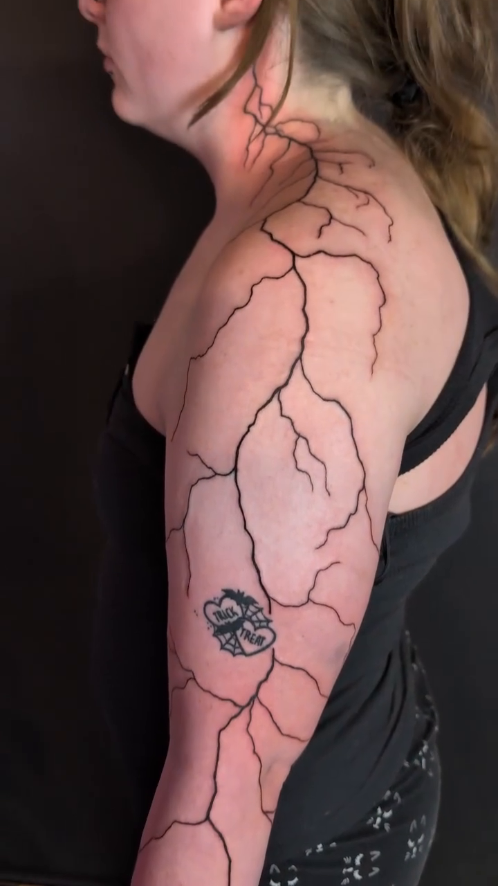 Tattoo by @jqln.ink — blackwork, illustrative