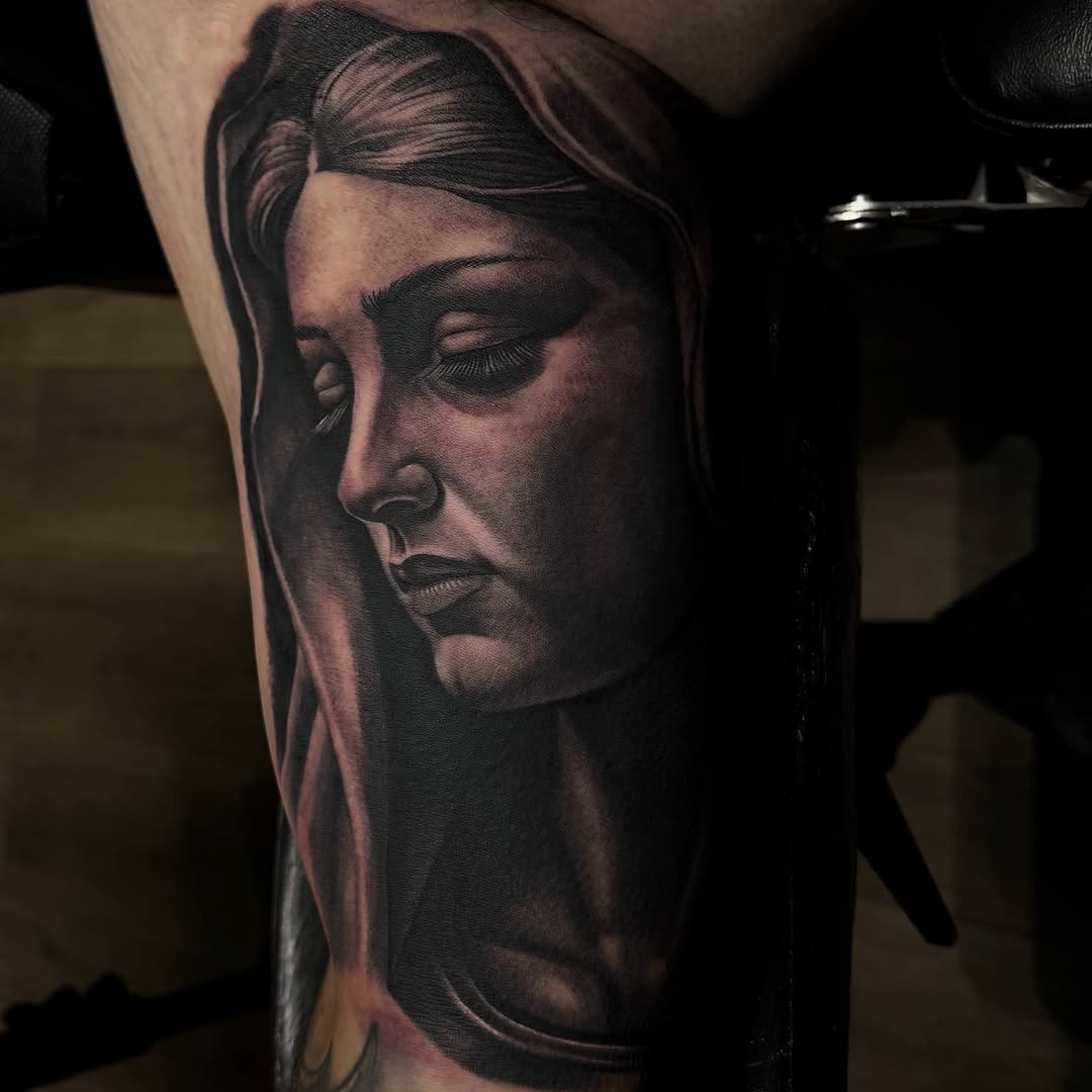 Tattoo by @tats.by.morb โ realism, black_and_grey