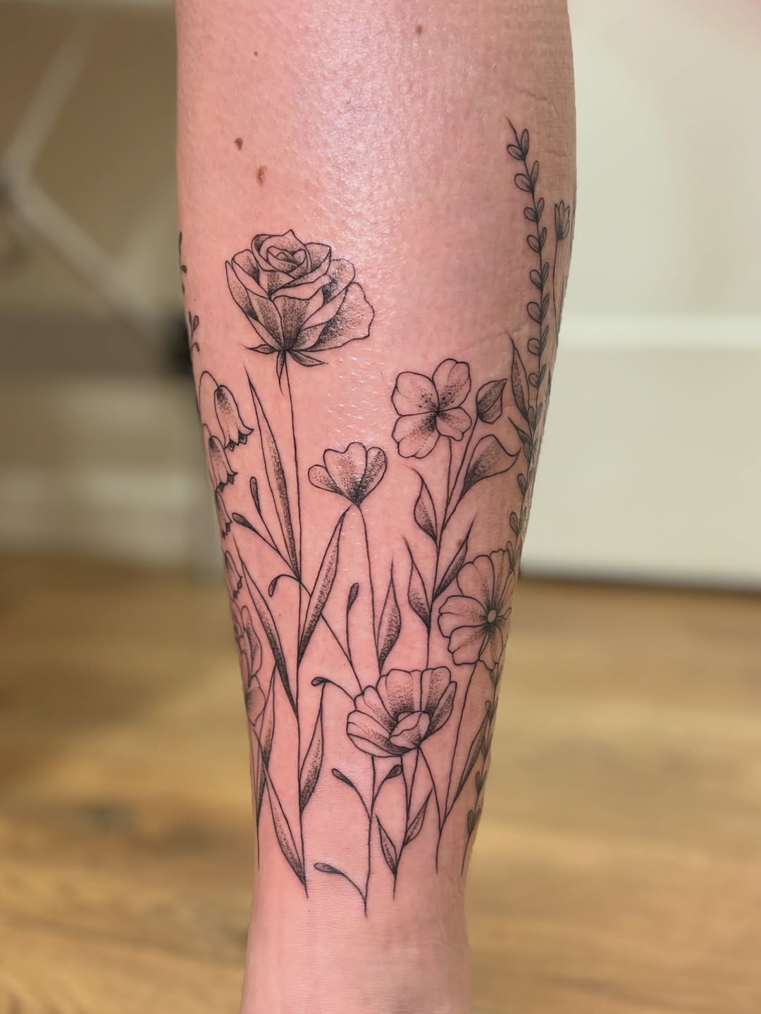 Tattoo by @athenaartistrytattoostudio — fine_line, black_and_grey