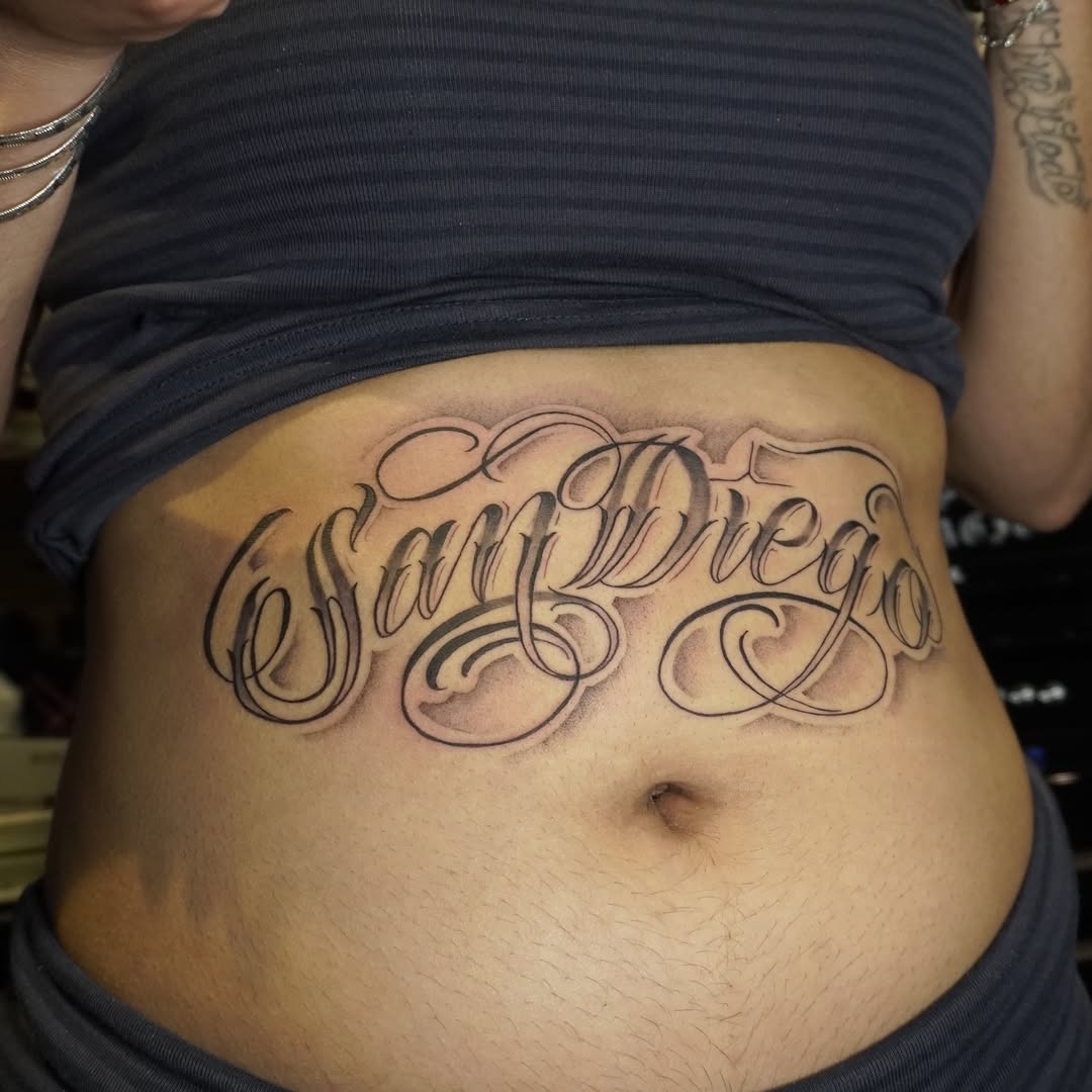 Tattoo by @adrian__tattoos — lettering_script, chicano