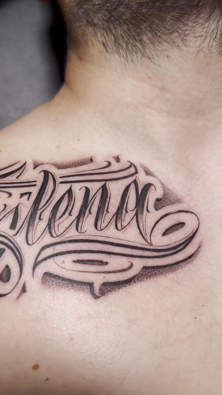 Tattoo by @mottatattoos โ lettering_script, black_and_grey
