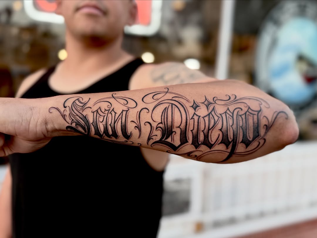 Tattoo by @barbs.tattoos — lettering_script, chicano