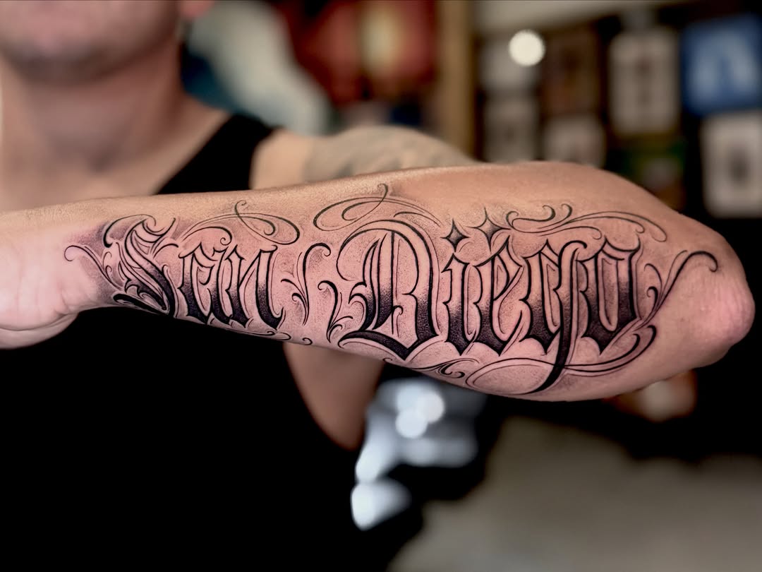Tattoo by @barbs.tattoos — lettering_script, chicano