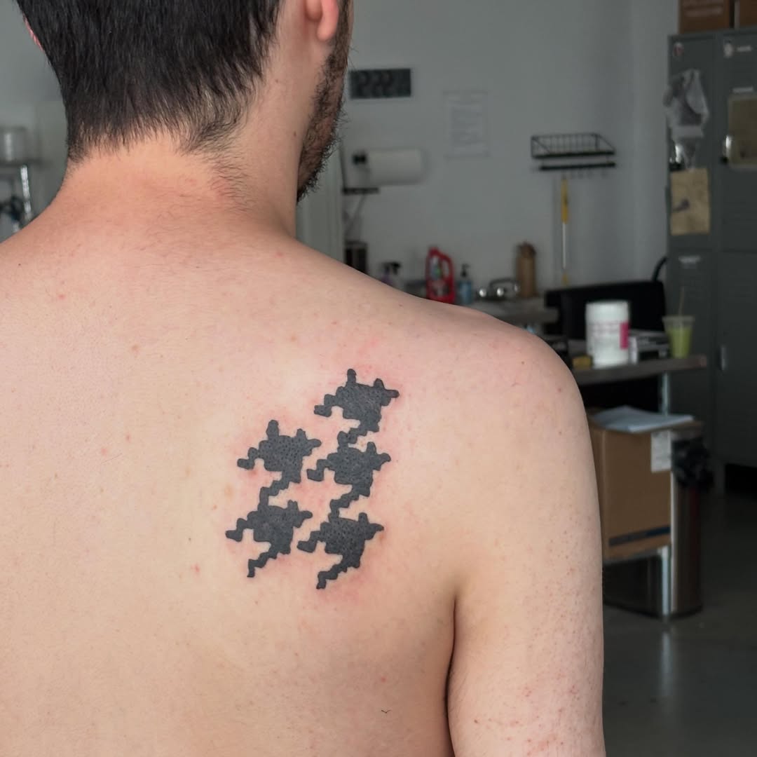 Tattoo by @spikecharms — geometric, blackwork