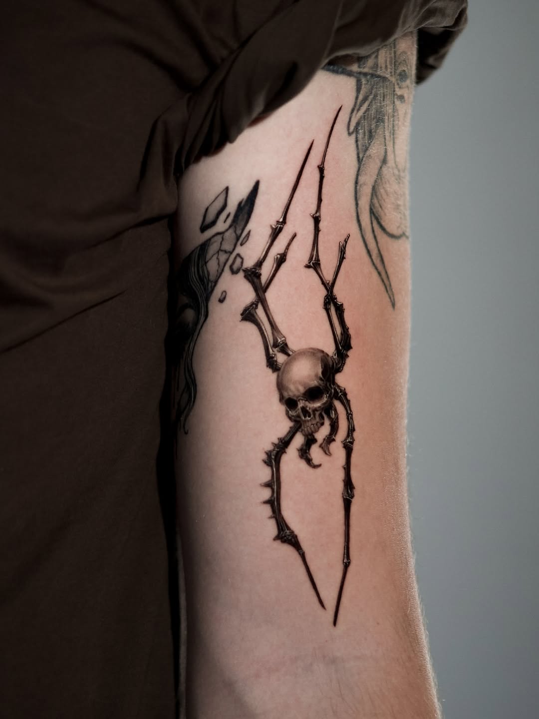 Tattoo by @comma_ttt — dark_realism, black_and_grey