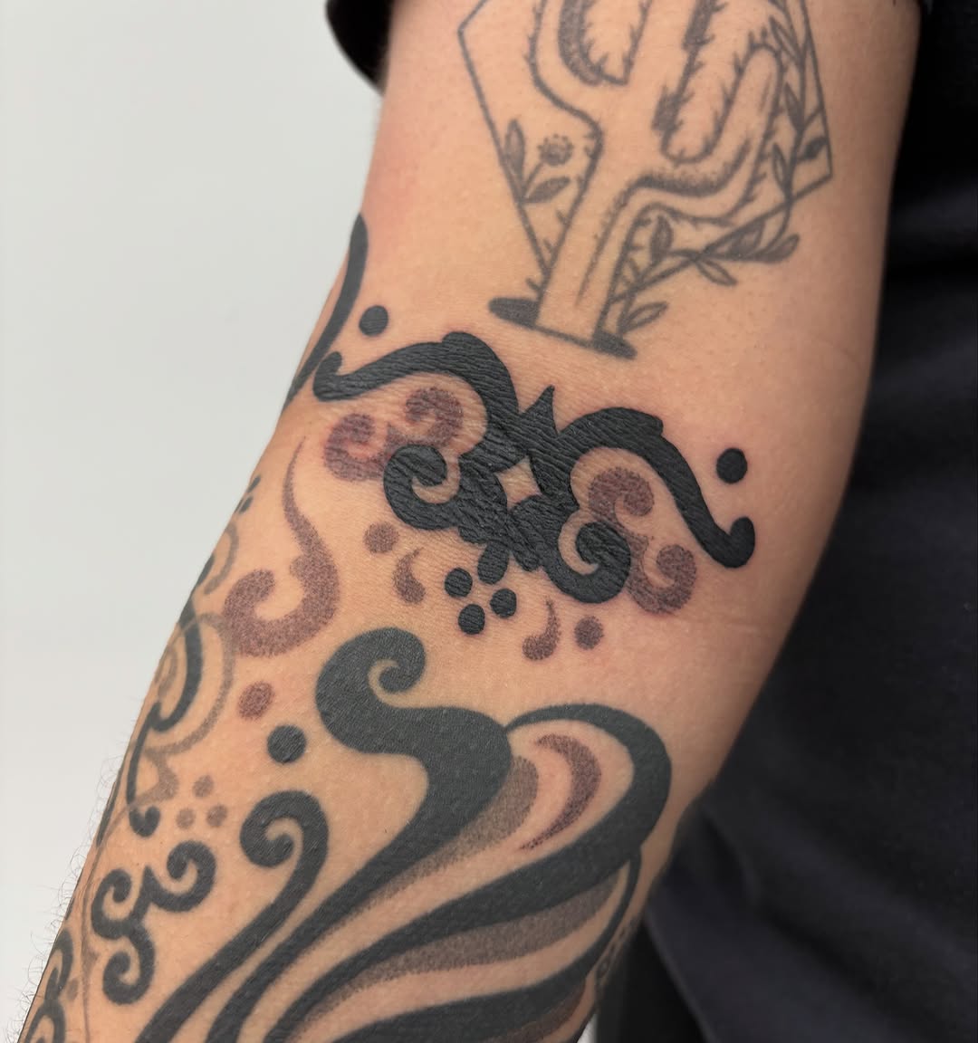 Tattoo by @slime.time.live — blackwork, ornamental