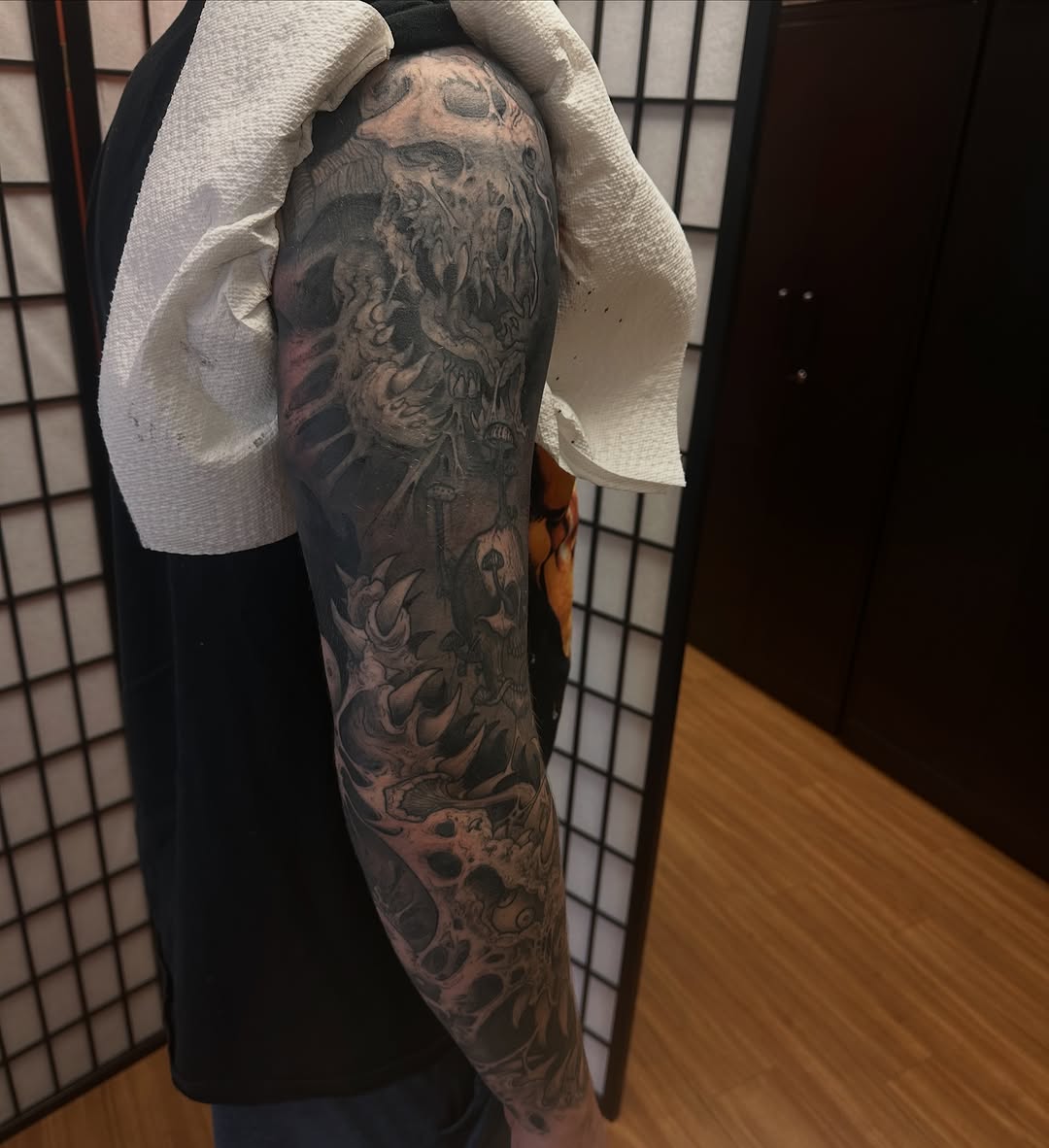 Tattoo by @carnivorousfx — dark_realism, black_and_grey