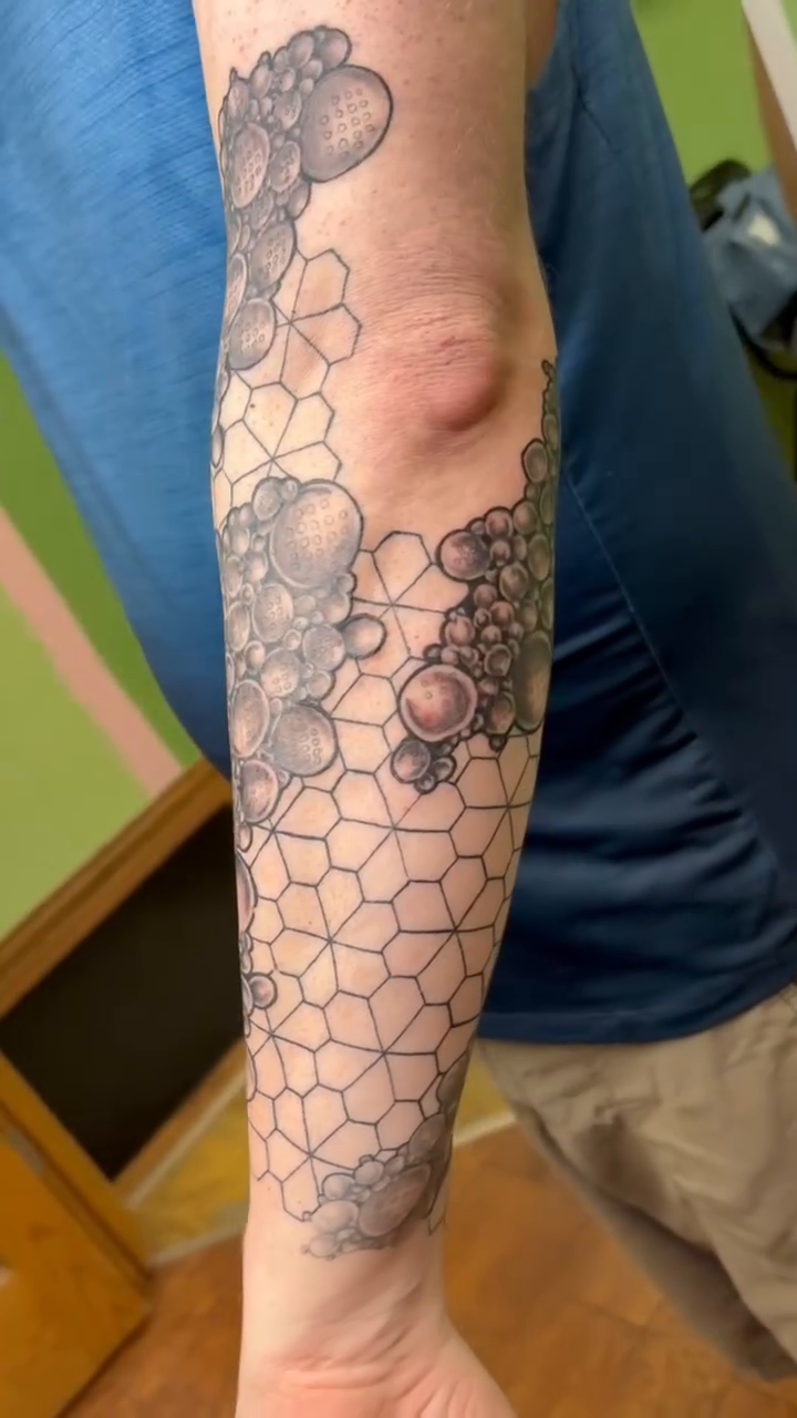 Tattoo by @meltrusty.taxtoos — geometric, dotwork