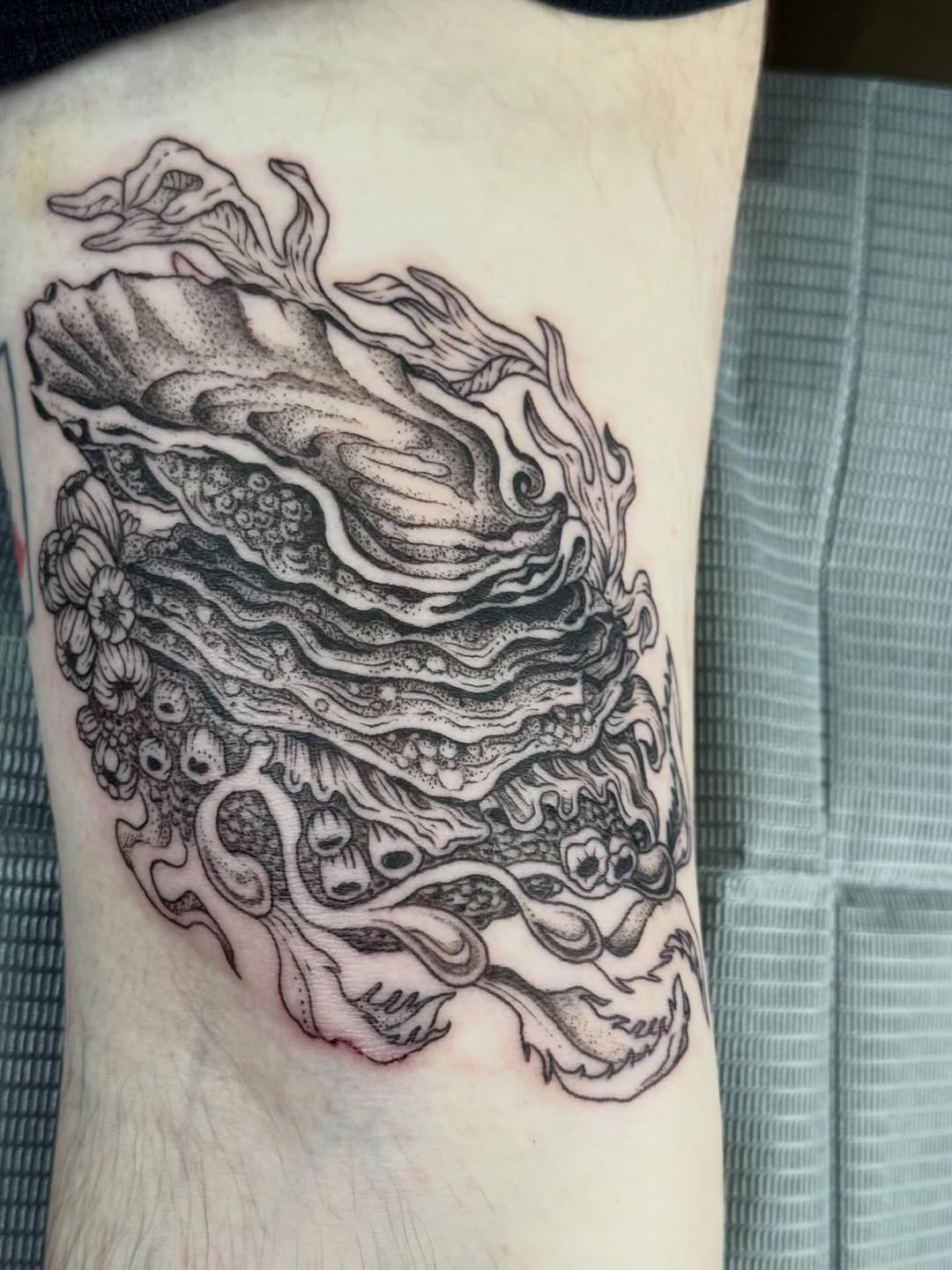 Tattoo by @writhingdirty — illustrative, dotwork