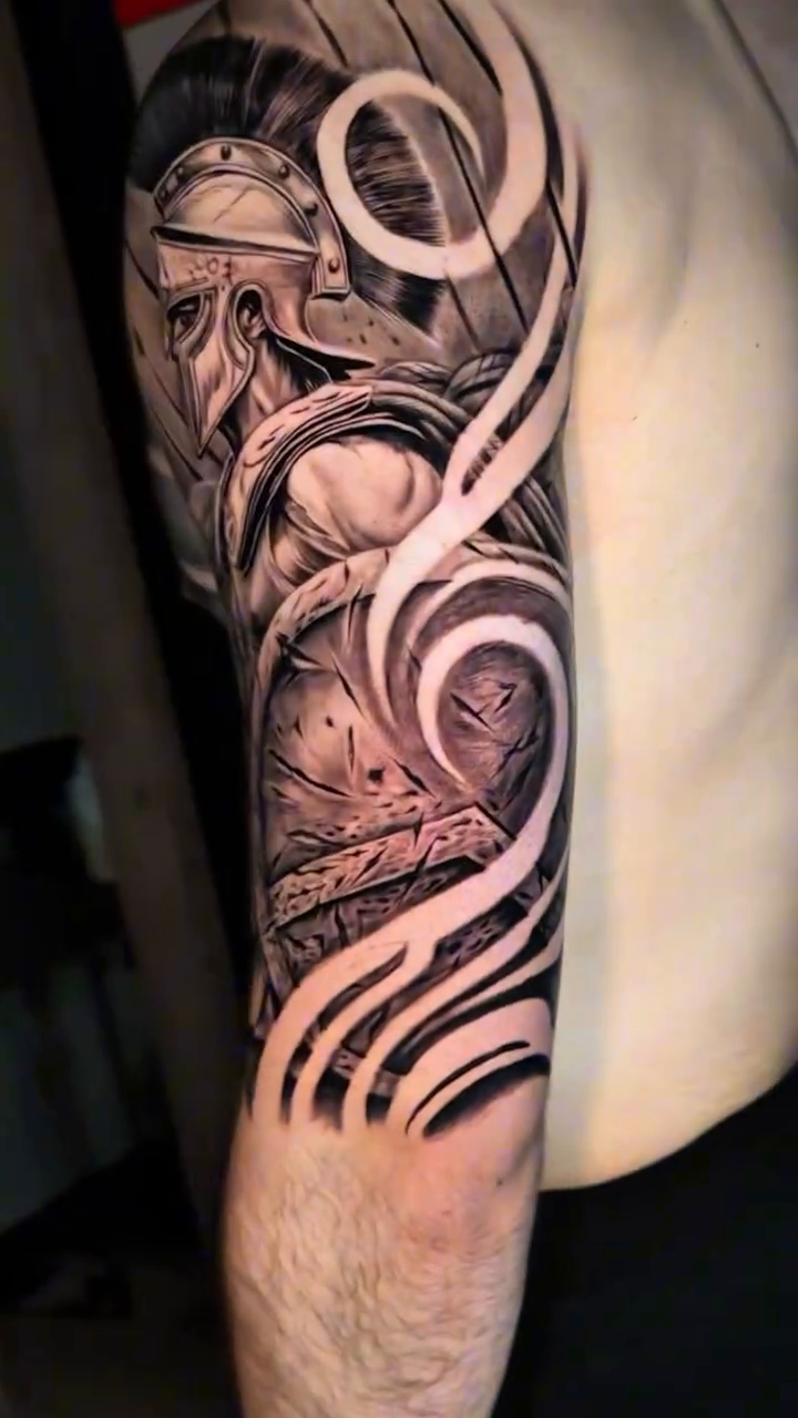 Tattoo by @sherifftattoos — realism, black_and_grey