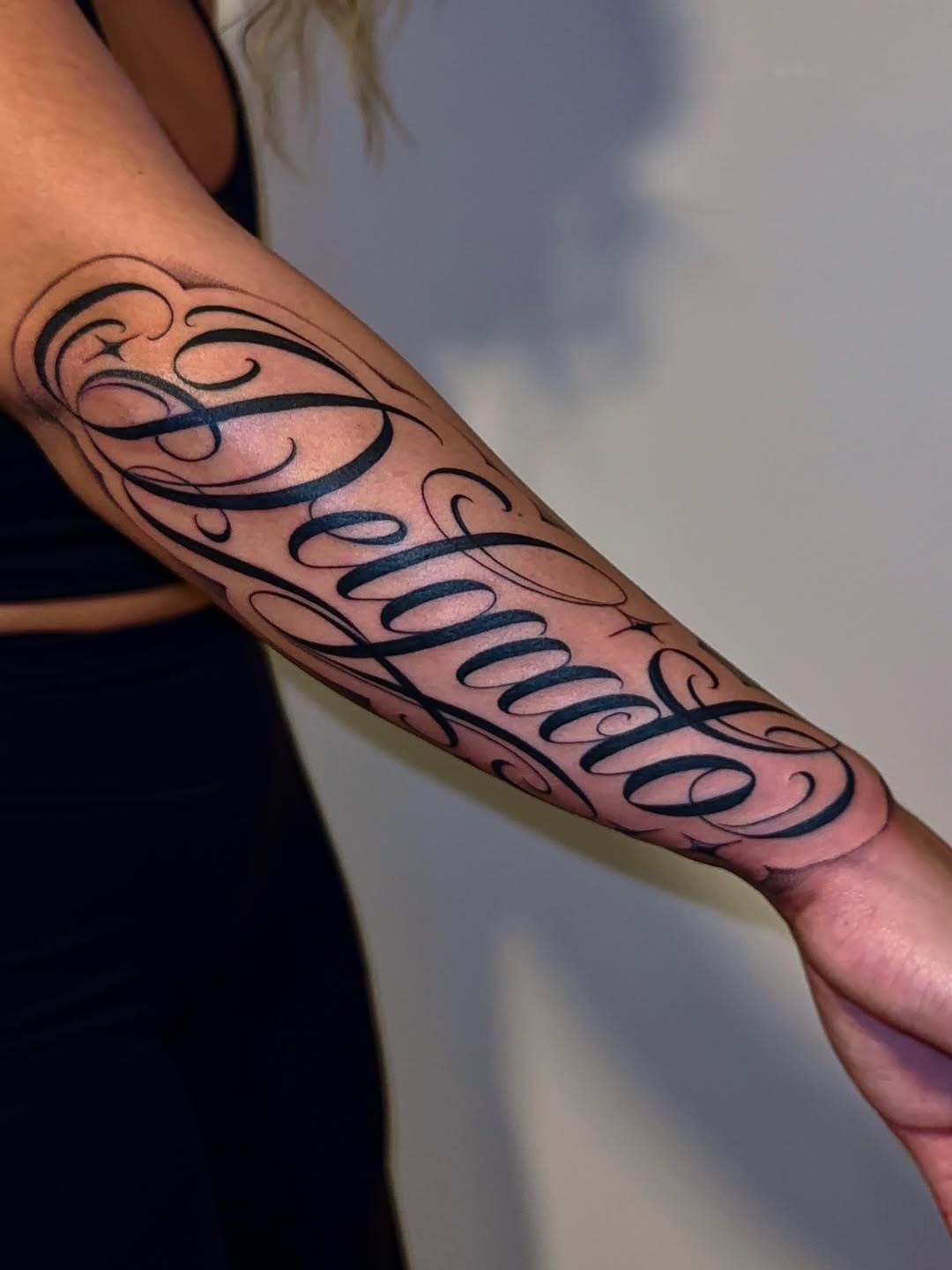 Tattoo by @vestavi.ink — lettering_script, chicano