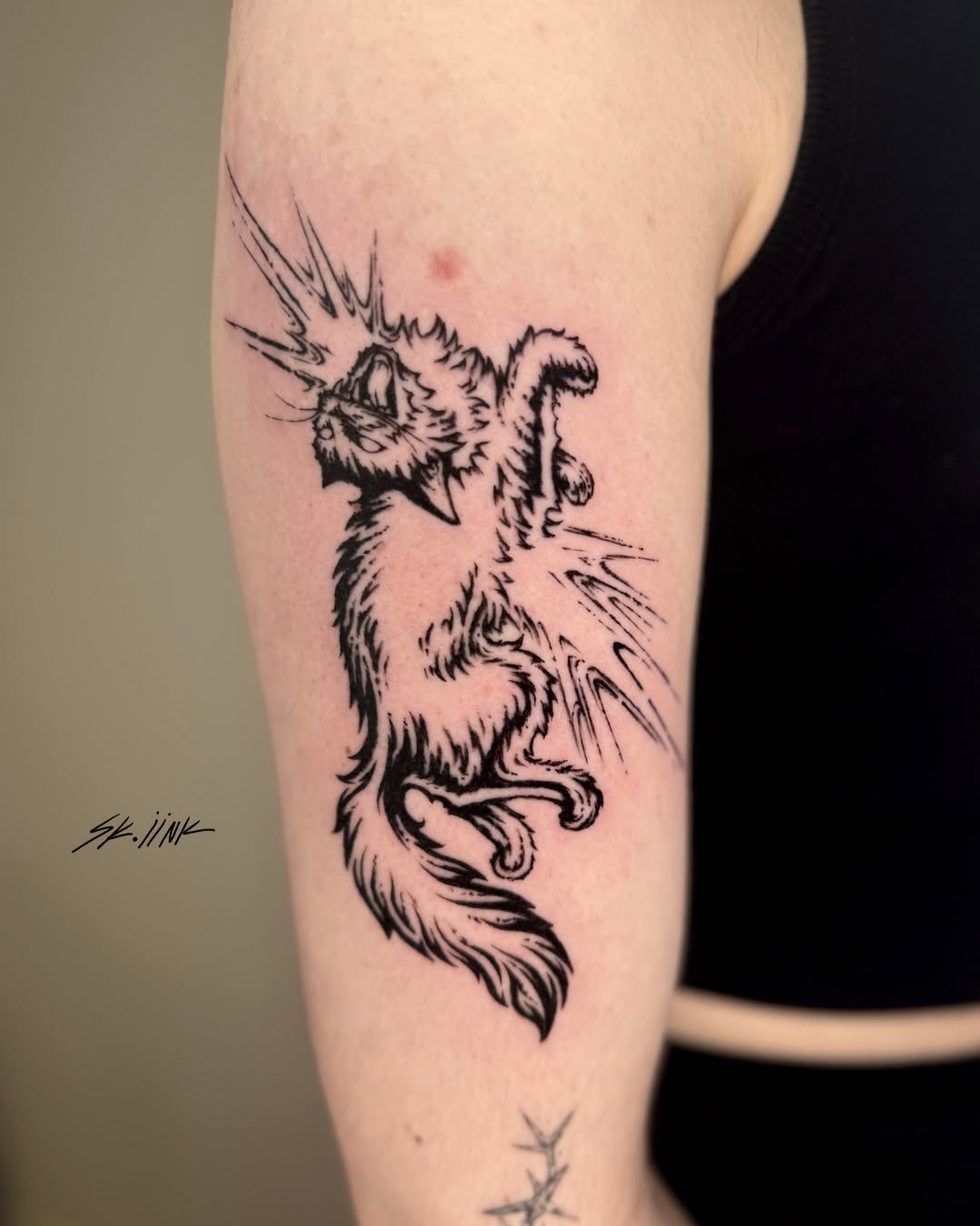 Tattoo by @sk.iink — illustrative, blackwork