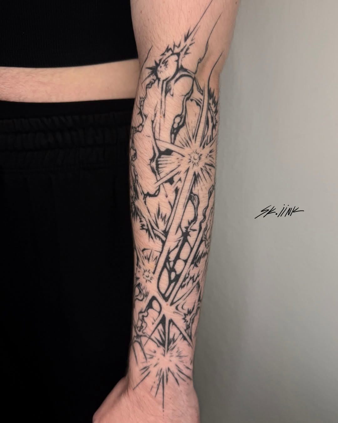 Tattoo by @sk.iink — illustrative, blackwork