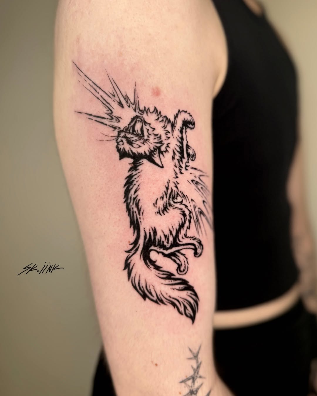Tattoo by @sk.iink — illustrative, blackwork