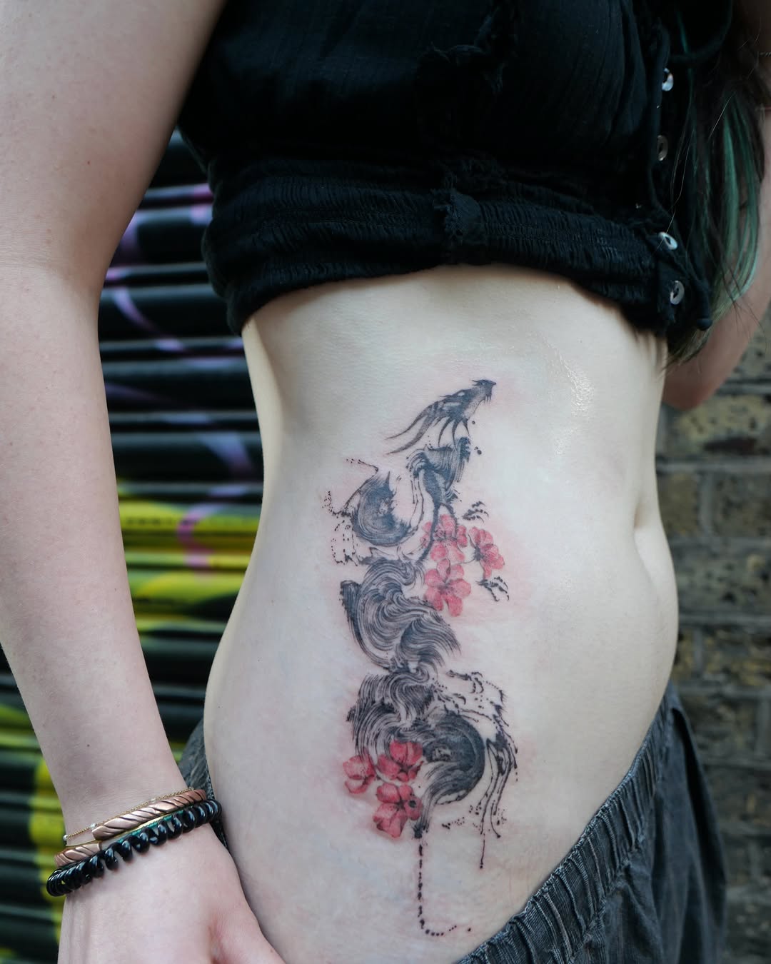 Tattoo by @dowha.tt — blackwork, watercolor