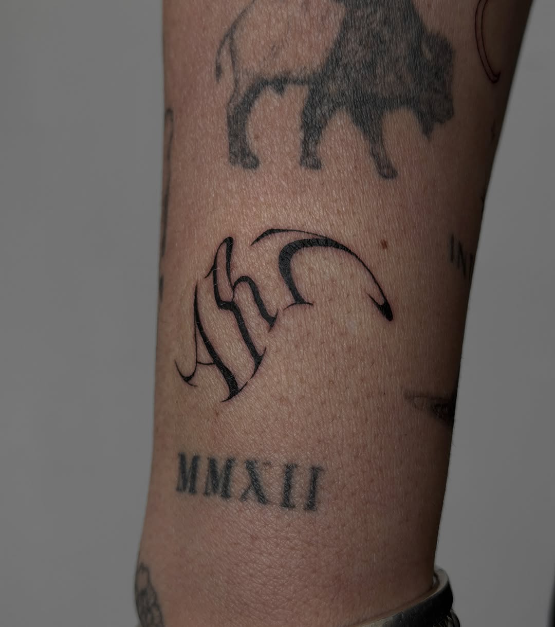 Tattoo by @andyoutattoo — lettering_script, illustrative