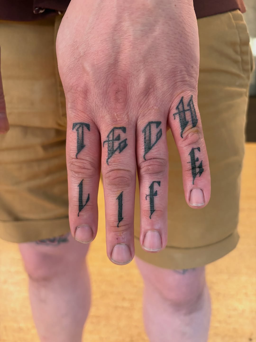 Tattoo by @kimberteatro — lettering_script, blackwork