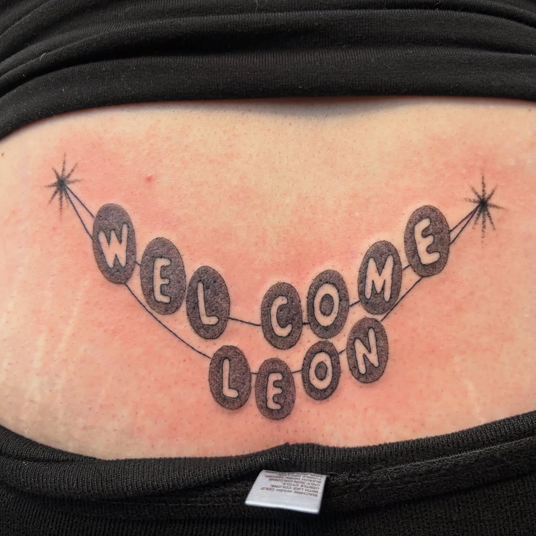 Tattoo by @vomit_goblin — lettering_script